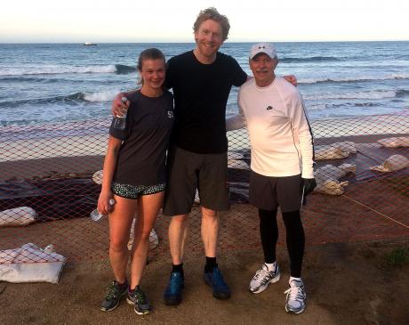 April 15 Fun Run first-place finisher Alastair Humphreys (center) posed with top finishers Julia Ogburn and Steve Maron following the early morning event by the Pacific Ocean.